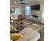 Cozy living room with modern fireplace, television and accent furniture at 740 Great Oak Pl, Villa Rica, GA 30180
