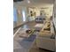 A bright, open-concept living room showcases a stylish sofa and kitchen at 740 Great Oak Pl, Villa Rica, GA 30180