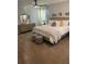 A main bedroom featuring a bed with decorative pillows, dresser, and sitting area at 740 Great Oak Pl, Villa Rica, GA 30180