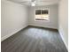This spacious bedroom features neutral carpet, ceiling fan and natural light at 121 Northwoods Rd, Sharpsburg, GA 30277