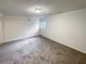 Spacious bonus room that is bright with natural light from standard window at 121 Northwoods Rd, Sharpsburg, GA 30277