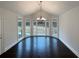 Sun-filled dining area featuring elegant chandelier and large windows at 121 Northwoods Rd, Sharpsburg, GA 30277