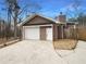A well-maintained detached garage offering ample space and storage solutions, enhancing the property's functionality and curb appeal at 121 Northwoods Rd, Sharpsburg, GA 30277