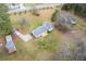 Spacious property featuring a well-maintained home, outbuildings, and a new wooden deck, all on a sizable lot at 1312 Milstead Ave, Conyers, GA 30012