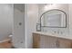 Stylish bathroom featuring double sinks, herringbone vanity, and tiled shower at 1312 Milstead Ave, Conyers, GA 30012