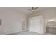 Spacious bedroom with ceiling fan, closet, neutral walls, and connecting bathroom at 1312 Milstead Ave, Conyers, GA 30012