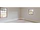 Bright bedroom features neutral walls, carpet floors, and natural light from two windows at 1312 Milstead Ave, Conyers, GA 30012