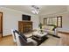 Bright living room with a brick fireplace and a large picture window at 1312 Milstead Ave, Conyers, GA 30012