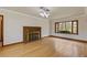 Spacious living room with hardwood floors, fireplace, and modern lighting at 1312 Milstead Ave, Conyers, GA 30012
