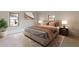 Serene main bedroom with windows, soft lighting, and neutral color palette at 1312 Milstead Ave, Conyers, GA 30012