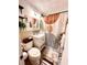Cozy bathroom with a unique shower curtain, vanity sink and toilet, complemented by botanical accents at 215 Piedmont Ne Ave # 2205, Atlanta, GA 30308
