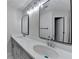 Bright bathroom featuring a double sink vanity, framed mirrors, and modern fixtures at 4654 Webster Way, Acworth, GA 30101