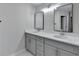 Bathroom featuring a double sink vanity, framed mirrors, and modern fixtures at 4654 Webster Way, Acworth, GA 30101