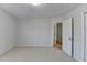 Spacious bedroom with plush carpeting and a doorway leading to another room at 4654 Webster Way, Acworth, GA 30101