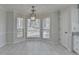 A cozy dining area with bright windows and a modern light fixture at 4654 Webster Way, Acworth, GA 30101
