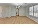Dining room with wainscoting, wood-look flooring, and natural light at 4654 Webster Way, Acworth, GA 30101