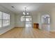 Dining room featuring a chandelier, wainscoting, and wood-look flooring at 4654 Webster Way, Acworth, GA 30101