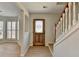 Inviting entryway features wood floors, stairs, and stylish front door with decorative glass at 4654 Webster Way, Acworth, GA 30101