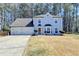 Charming two-story home boasts a 2-car garage, manicured front lawn, and traditional architectural details at 4654 Webster Way, Acworth, GA 30101