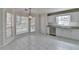 Bright kitchen with white cabinets, stainless steel appliances, and large windows at 4654 Webster Way, Acworth, GA 30101