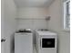 A bright laundry room featuring a modern washer and dryer at 4654 Webster Way, Acworth, GA 30101