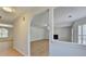 Bright living room featuring an archway, fireplace, and wood-look flooring at 4654 Webster Way, Acworth, GA 30101
