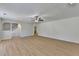 Open-concept living space with wood-look flooring and staircase at 4654 Webster Way, Acworth, GA 30101