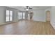 Bright living room with natural light, wood-look flooring, and modern ceiling fan at 4654 Webster Way, Acworth, GA 30101