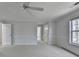 A large main bedroom with neutral colors, carpet flooring, and a ceiling fan at 4654 Webster Way, Acworth, GA 30101