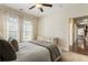 Bedroom featuring a neutral color scheme, plush bedding, and a doorway leading to another room at 625 Aunt Lucy Sw Ln # 29, Smyrna, GA 30082