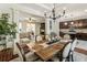 Open-concept dining area with wood table, views to kitchen and living space at 625 Aunt Lucy Sw Ln # 29, Smyrna, GA 30082