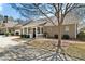 Charming home exterior with a screened in porch and well-maintained landscaping at 625 Aunt Lucy Sw Ln # 29, Smyrna, GA 30082