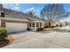 Exterior view of a home with a spacious two-car garage and pristine driveway at 625 Aunt Lucy Sw Ln # 29, Smyrna, GA 30082