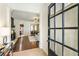 Welcoming foyer featuring hardwood floors and glass door, leading to living spaces with fireplace and dining room at 625 Aunt Lucy Sw Ln # 29, Smyrna, GA 30082