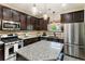 Well-equipped kitchen with island, stainless steel appliances, and abundant counter space at 625 Aunt Lucy Sw Ln # 29, Smyrna, GA 30082