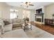 Comfortable living room with fireplace and hardwood floors, creating a warm and inviting space for relaxation at 625 Aunt Lucy Sw Ln # 29, Smyrna, GA 30082