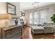 Comfortable living room with hardwood floors, neutral tones, and natural light at 625 Aunt Lucy Sw Ln # 29, Smyrna, GA 30082