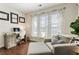 Bright office space with desk, couch, and ample natural light from large windows at 625 Aunt Lucy Sw Ln # 29, Smyrna, GA 30082