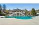 Community pool with a two-story clubhouse with stairs leading to a second story porch overlooking the pool at 625 Aunt Lucy Sw Ln # 29, Smyrna, GA 30082