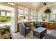Cozy sunroom with wicker furniture, potted plants, and plenty of natural light at 625 Aunt Lucy Sw Ln # 29, Smyrna, GA 30082