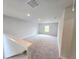 Upstairs bonus room with neutral walls and plush carpet, flooded with natural light from a window at 2654 Mourning Dove Drive (Lot 39), Grayson, GA 30017