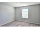 Bedroom with carpet flooring and a window offering natural light at 2714 Mourning Dove Drive (Lot 33), Grayson, GA 30017