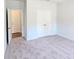 Another comfortable bedroom with neutral carpeting and double door closet at 2714 Mourning Dove Drive (Lot 33), Grayson, GA 30017