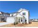 Charming new construction home features white siding, black shutters, and a welcoming front porch at 2714 Mourning Dove Drive (Lot 33), Grayson, GA 30017