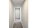 Hallway with neutral carpet and white doors at 2714 Mourning Dove Drive (Lot 33), Grayson, GA 30017