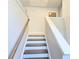 Carpeted staircase with railing leads to the upper level at 2714 Mourning Dove Drive (Lot 33), Grayson, GA 30017