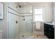 Updated bathroom with a glass shower, white subway tile, and black accents for a modern look at 415 Fayetteville Rd, Decatur, GA 30030