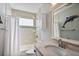 Well-lit bathroom with a combination tub and shower, mosaic tile accents, and a dolphin wall decoration at 415 Fayetteville Rd, Decatur, GA 30030