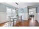 Elegant dining room with hardwood floors, wainscoting, and large windows at 415 Fayetteville Rd, Decatur, GA 30030