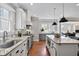 Stylish kitchen featuring a granite counters, stainless steel appliances, and island with seating at 415 Fayetteville Rd, Decatur, GA 30030